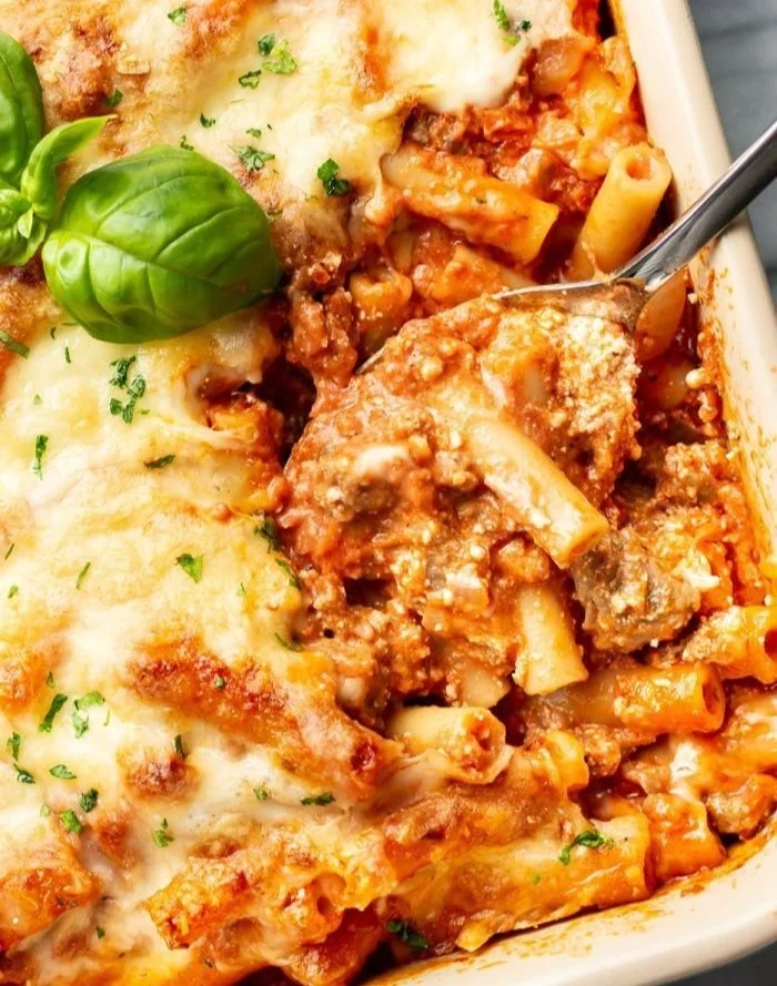 Delicious baked ziti topped with gooey cheese and fresh herbs