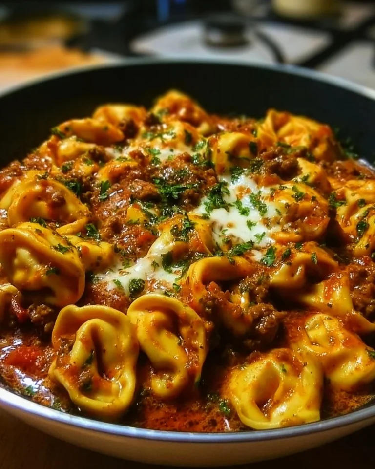 Plate of Beef Enchilada Tortellini topped with cheese and cilantro