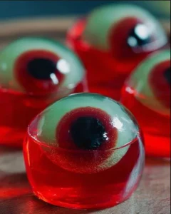 Halloween-themed eyeball jello shots in a decorative serving dish