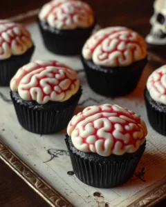 Spooky skeleton cupcakes with brain topping for Halloween celebration