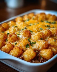 Delicious Tater Tot Casserole topped with crispy golden tater tots and melted cheese.