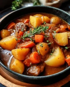 Bowl of Irish vegetarian stew filled with colorful vegetables and herbs