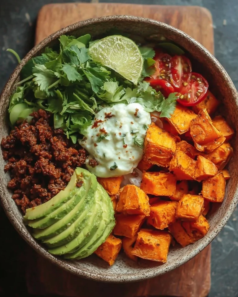 Colorful sweet potato taco bowl with beans and toppings