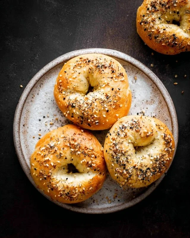 Three ingredient air fryer bagels, golden and chewy, served on a plate.