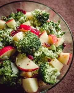 Fresh and colorful Apple Broccoli Salad with nuts and dressing