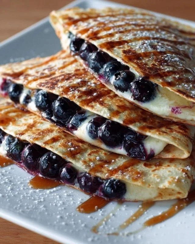 Delicious blueberry breakfast quesadilla filled with fresh blueberries and cheese