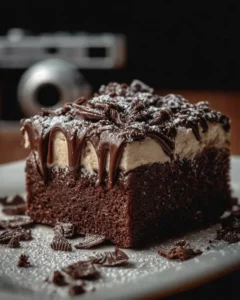 Delicious Brownie Refrigerator Cake topped with chocolate and whipped cream