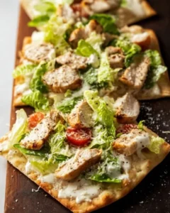 Delicious Chicken Caesar Flatbread topped with grilled chicken and Caesar dressing