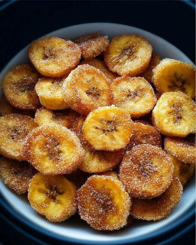 Crispy cinnamon-sugar air fryer banana chips on a plate