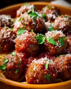 Plate of classic Italian meatballs garnished with herbs