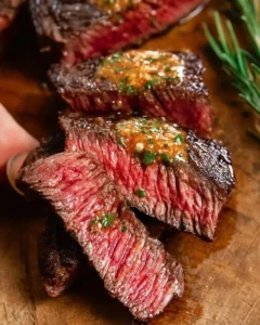 Delicious Cowboy Butter Steak garnished with herbs and spices