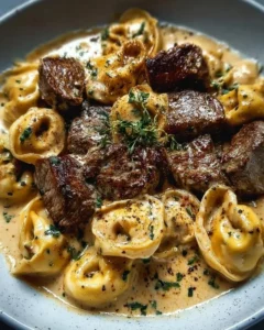 Cracked Garlic Steak Tortellini served in a creamy sauce dish