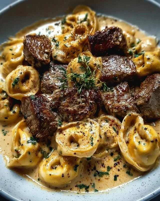 Cracked Garlic Steak Tortellini served in a creamy sauce dish