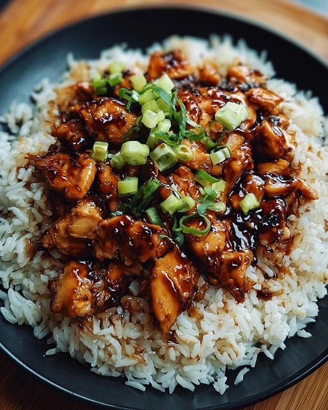 Delicious Honey BBQ Chicken served over fluffy rice, garnished with greens
