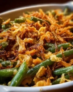 Ina Garten's gourmet green bean casserole recipe served in a baking dish