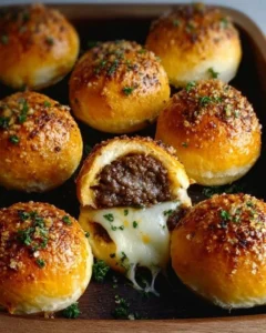 Delicious Garlic Parmesan Cheeseburger Bombs served on a plate.