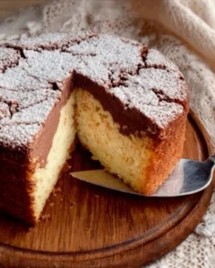 Slice of Italian Love Cake with creamy frosting and fruit garnish