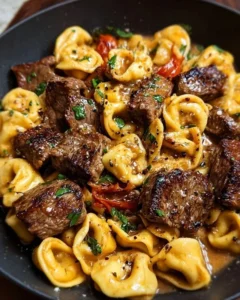 One-Pan Cowboy Butter Tortellini with juicy steak bites served in a skillet