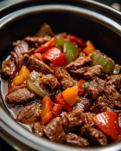 Delicious crock pot pepper steak recipe with tender beef and colorful peppers