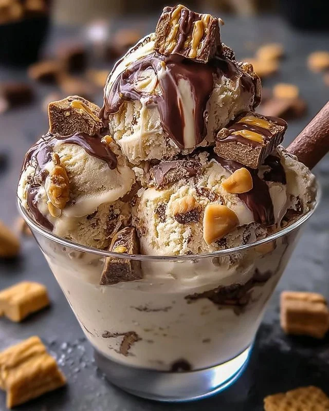 Delicious Snickers and Reese's cookie dough ice cream in a bowl