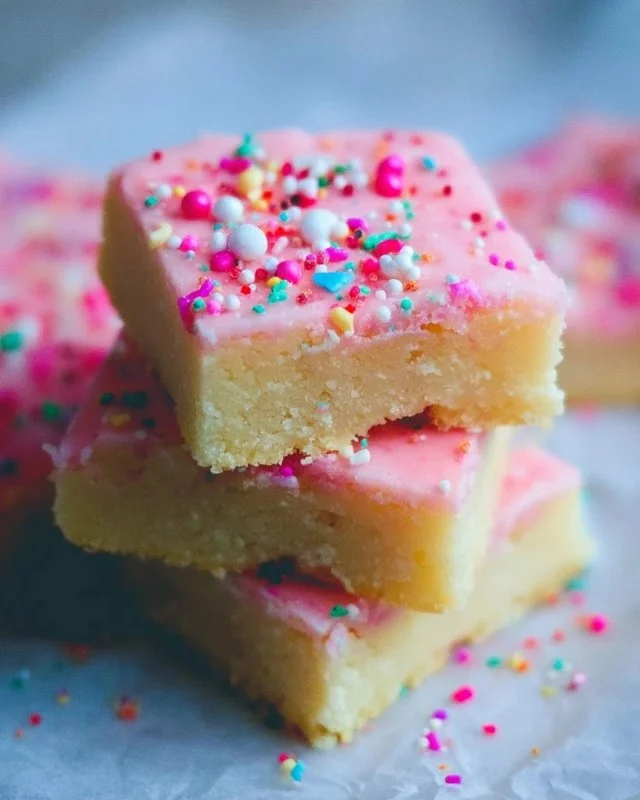 Delicious homemade sugar cookie bars decorated with colorful sprinkles.