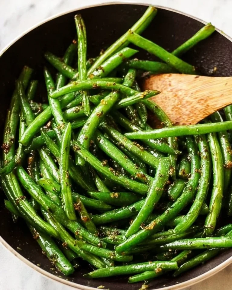 Delicious sautéed green beans with butter and garlic on a plate