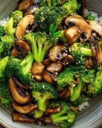 Vegan broccoli and mushroom stir fry served in a colorful bowl