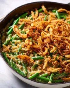 Vegan green bean casserole served in a dish with crispy toppings