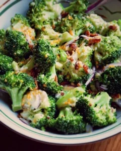 Fresh broccoli salad with colorful vegetables and dressing