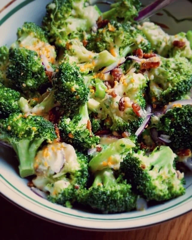 Fresh broccoli salad with colorful vegetables and dressing
