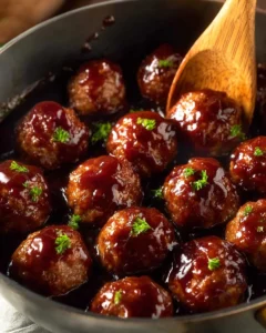Delicious grape jelly beef meatballs served in a savory sauce.