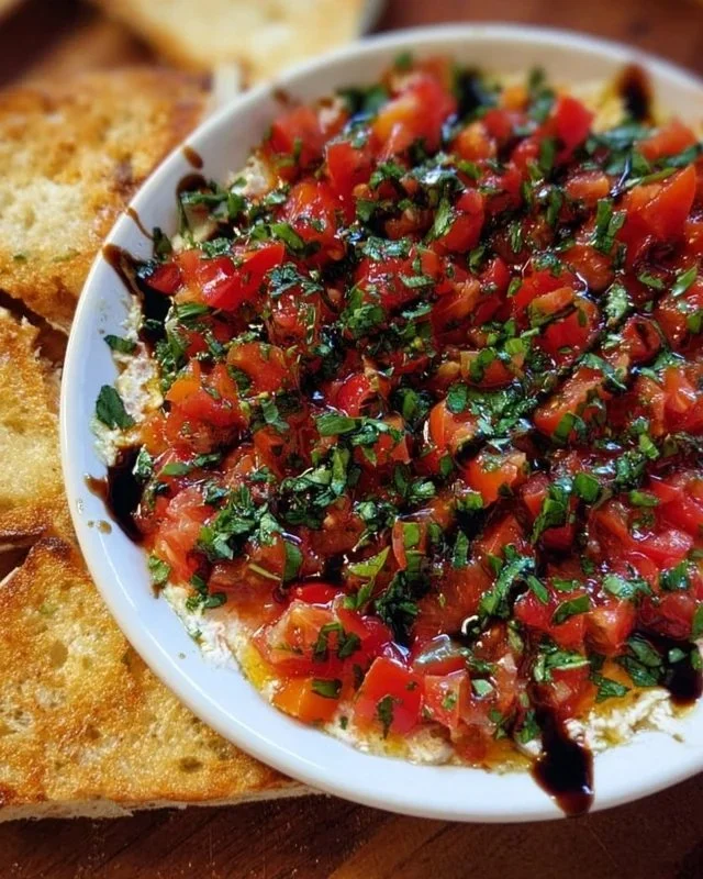 Delicious bruschetta dip served with crispy bread and fresh herbs