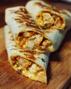Cheesy Garlic Chicken Wraps featuring melted cheese and garlic chicken filling.
