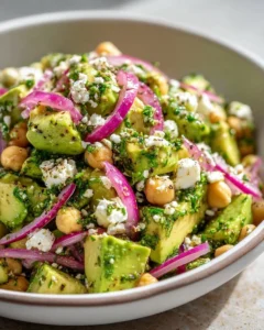 Chickpea Feta Avocado Salad with fresh vegetables in a bowl