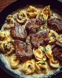 Cracked garlic steak tortellini served in a creamy sauce