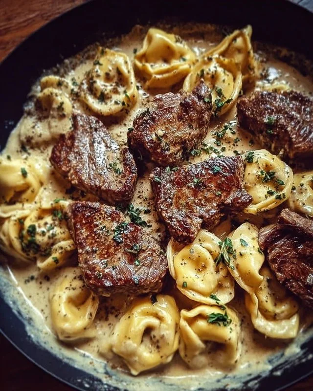 Cracked garlic steak tortellini served in a creamy sauce