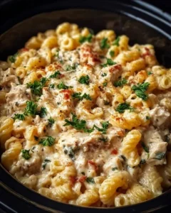 Creamy chicken pasta prepared in a crockpot, ready to serve