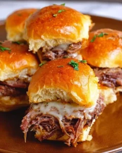Delicious French Dip Sliders served with savory dipping sauce