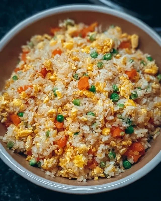 Bowl of instant pot fried rice with vegetables and eggs.
