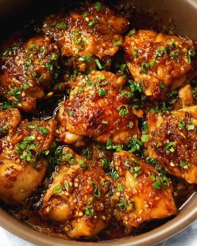 Instant Pot honey garlic chicken served on a plate with rice and vegetables