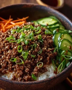 Delicious Korean Ground Beef Bowl topped with fresh vegetables and sesame seeds