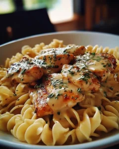 One-Pan Chicken served with buttered noodles on a plate