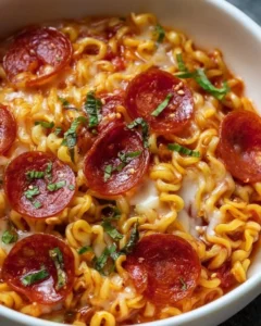 Bowls of Pizza Ramen topped with fresh ingredients and melted cheese