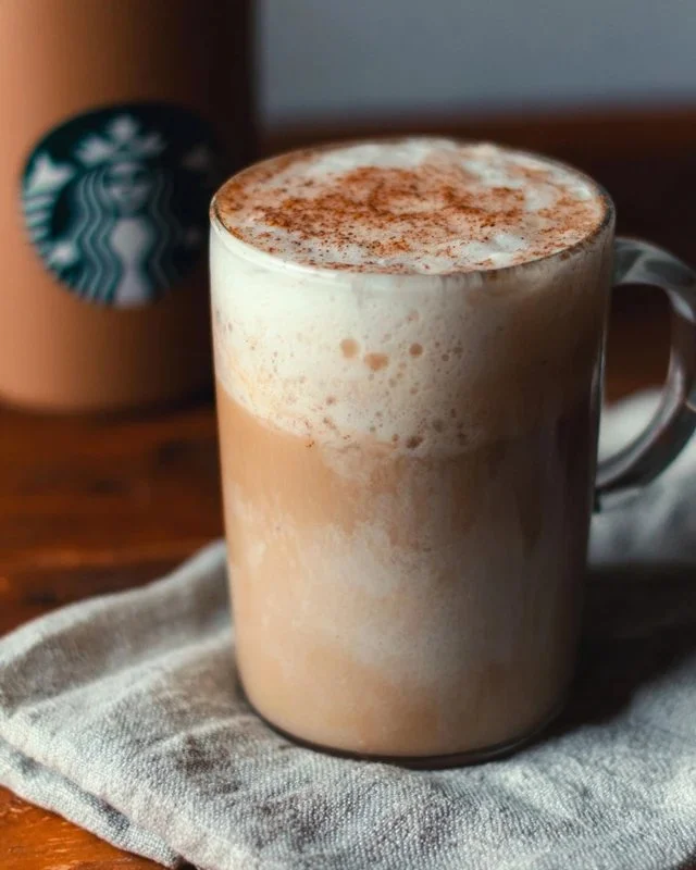 Starbucks Chai Tea Latte in a stylish cup, showcasing its rich color and frothy texture.