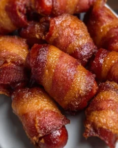 Platter of Bacon Wrapped Little Smokies appetizers freshly cooked and ready to serve.