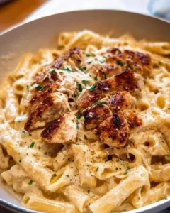 Delicious Chicken Alfredo pasta served with grated Parmesan and fresh herbs