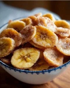 Cinnamon-sugar air fryer banana chips in a bowl ready to eat