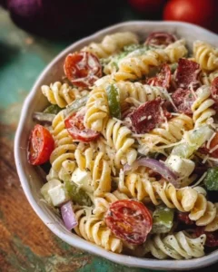 Delicious classic pasta salad with colorful vegetables and dressing