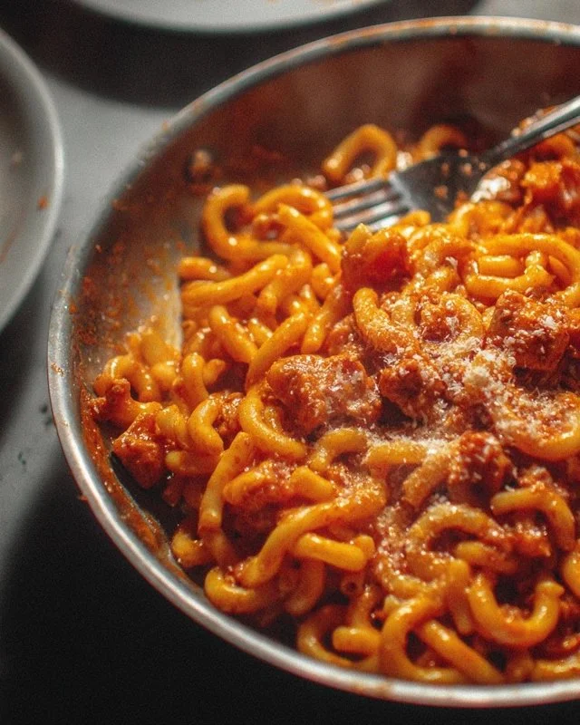 A delicious bowl of Dirty Pasta topped with fresh herbs and spices.