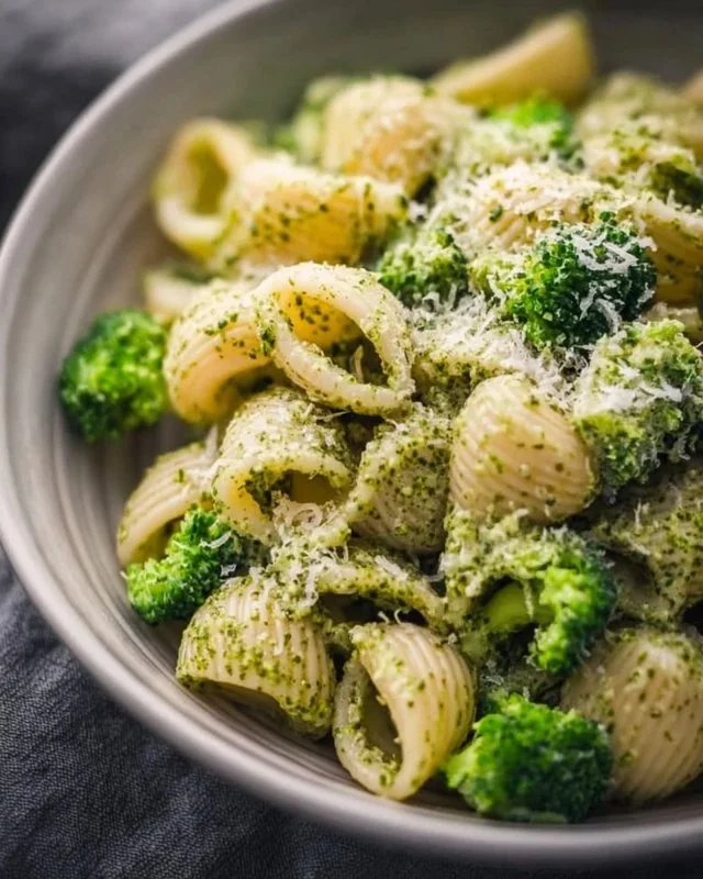 Delicious healthy broccoli pasta garnished with herbs and parmesan